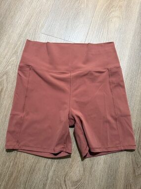 Vuori Stride Stride Shorts in Rose Clay with side pockets